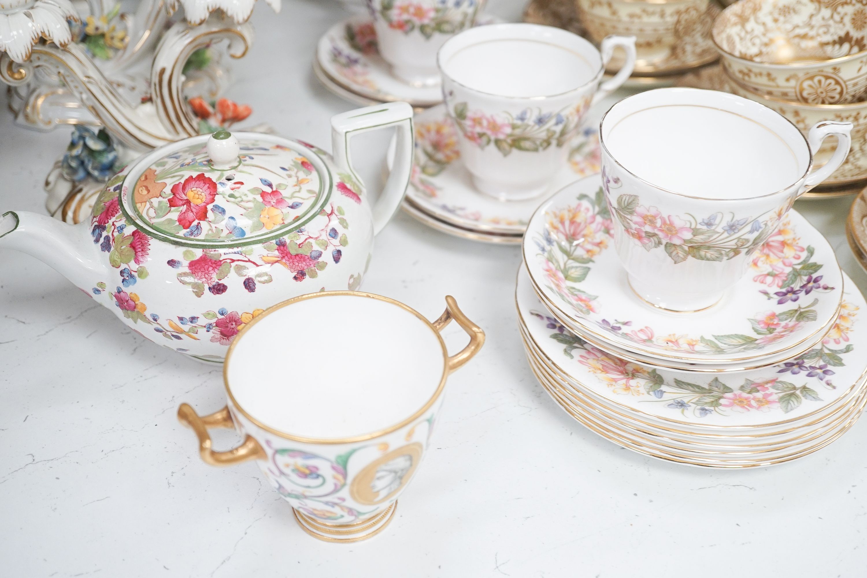 A Crown Staffordshire fifty nine piece part tea set and dessert service, central flowers and gilt borders